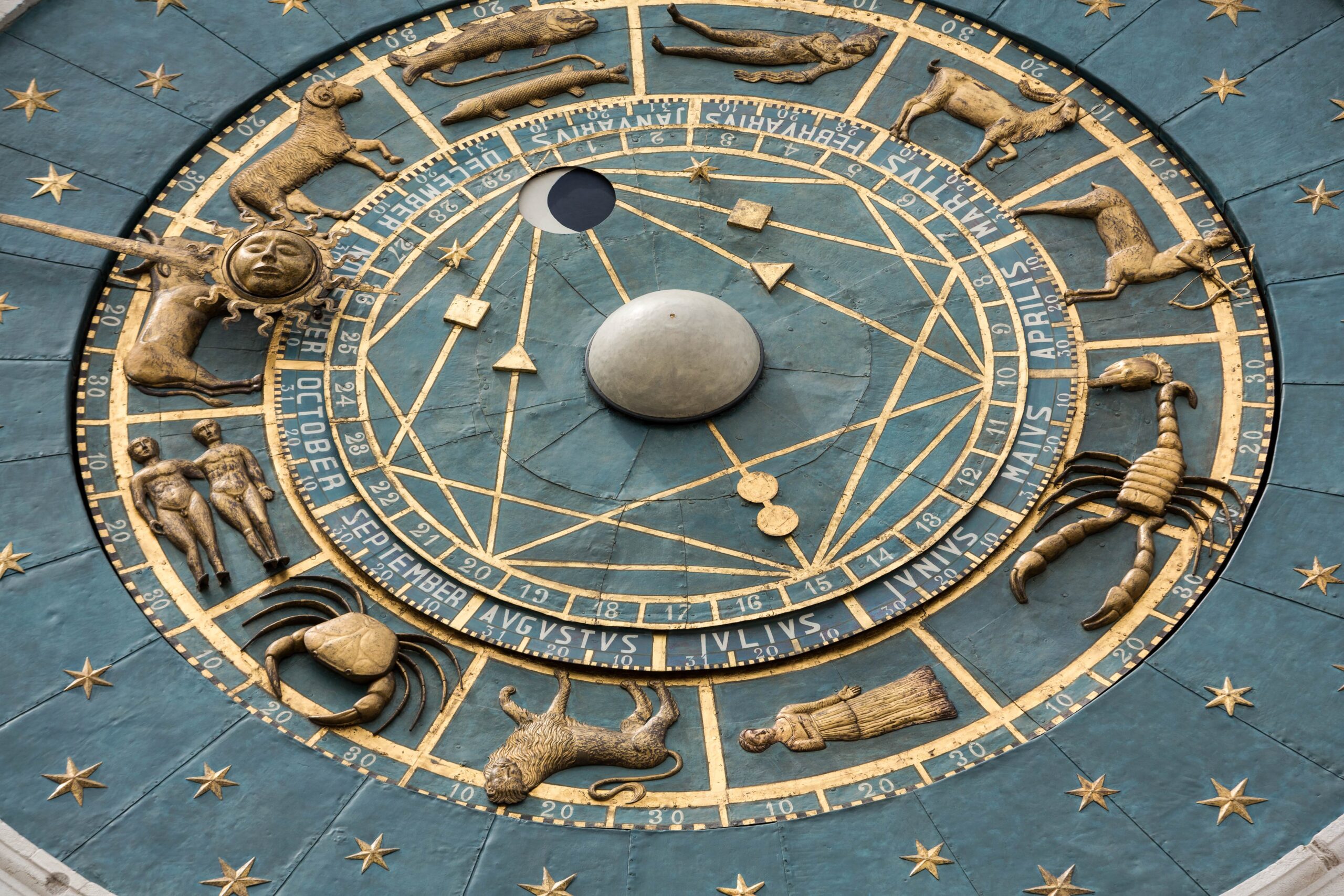 The picture shows a big astronomical clock. It displays the complex but structured constellations in astrology. 